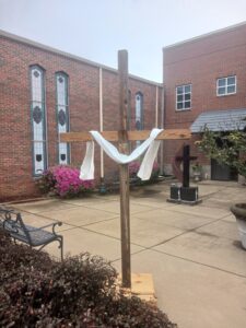 Outdoor white draped cross picture